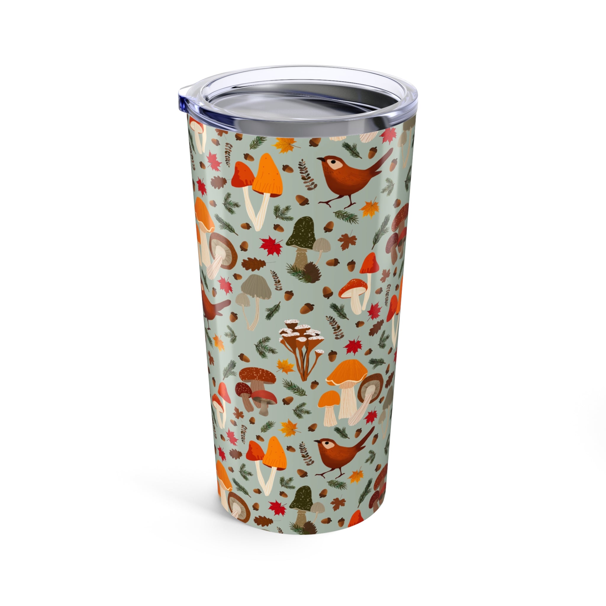 Tumbler with autumn-themed design featuring mushrooms and birds on a light blue background